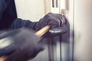 thief breaking into a home
