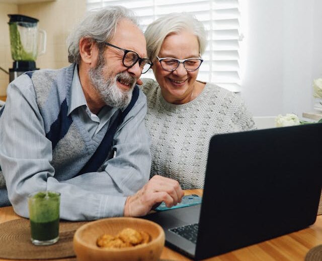 older couple looking at a laptop together